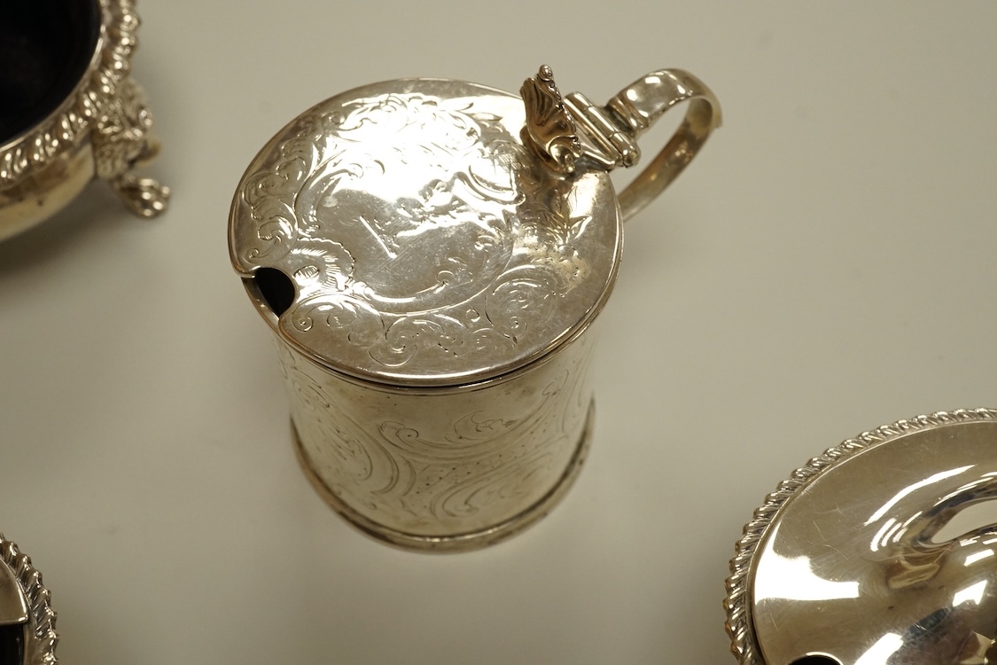A Victorian silver drum mustard pot, a pair of later silver mustard pots and two silver salts including Victorian.